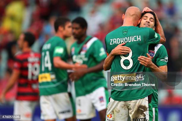 Ruben Zadkovich of the Jets hugs team mate Zenon Caravella at full time after victory over the Wanderers following the round 21 A-League match...