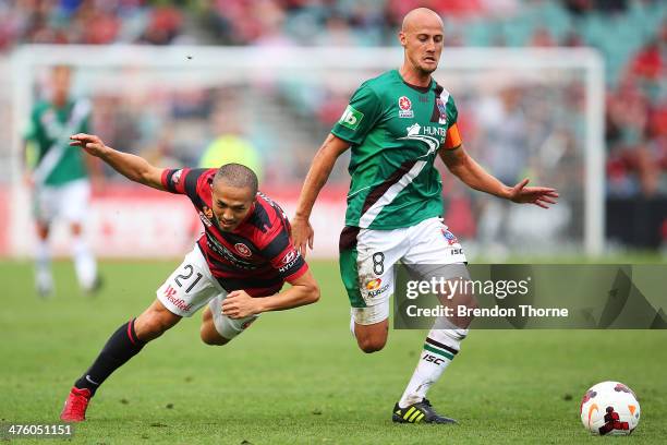 Ruben Zadkovich of the Jets competes with Shinji Ono of the Wanderers during the round 21 A-League match between the Western Sydney Wanderers and the...