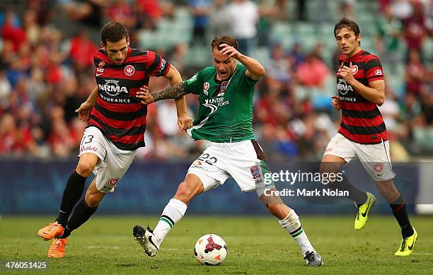 Matthew Spiranovic of the Wanderers and Adam Taggart of the Jets contest possession during the round 21 A-League match between the Western Sydney...