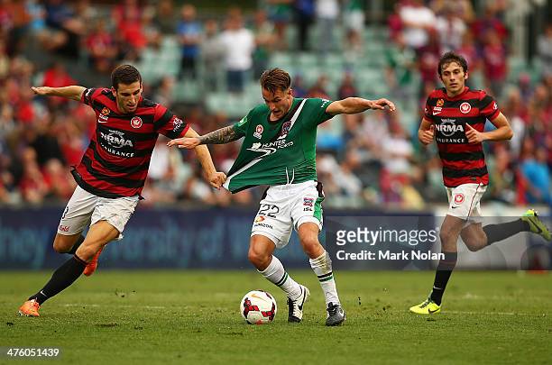 Matthew Spiranovic of the Wanderers and Adam Taggart of the Jets contest possession during the round 21 A-League match between the Western Sydney...