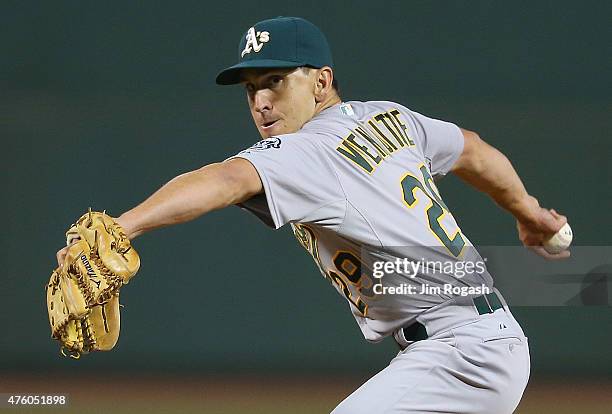 Pat Venditte of the Oakland Athletics throws on the right side in relief in the seventh inning against the Boston Red Sox at Fenway Park on June 5,...