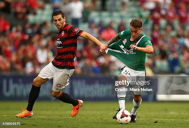 Matthew Spiranovic of the Wanderers pulls Adam Taggart of the Jets off the ball during the round 21 A-League match between the Western Sydney...