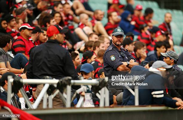 Police keep an eye on the North terrace RBB fans during the round 21 A-League match between the Western Sydney Wanderers and the Newcastle Jets at...