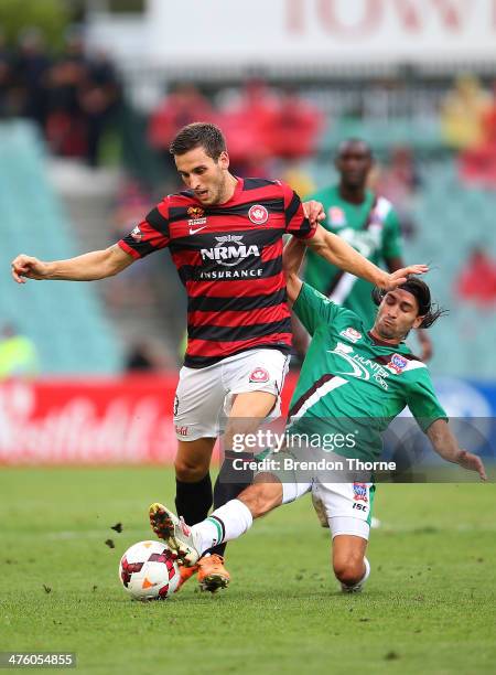 Matthew Spiranovic of the Wanderers competes with Zenon Caravella of the Jets during the round 21 A-League match between the Western Sydney Wanderers...