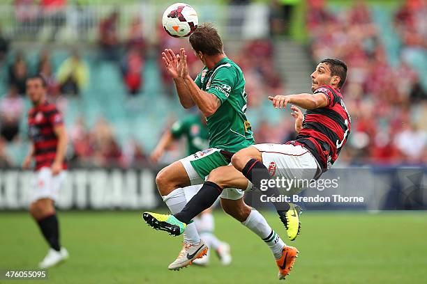 Joel Griffiths of the Jets competes with Adam D'Apuzzo of the Wanderers during the round 21 A-League match between the Western Sydney Wanderers and...