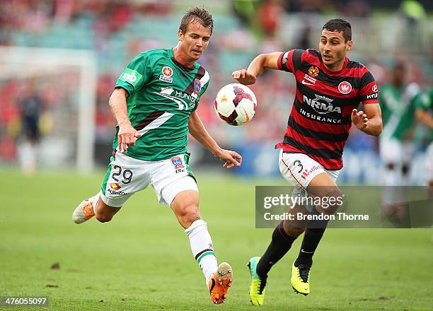 Joel Griffiths of the Jets competes with Adam D'Apuzzo of the Wanderers during the round 21 A-League match between the Western Sydney Wanderers and...