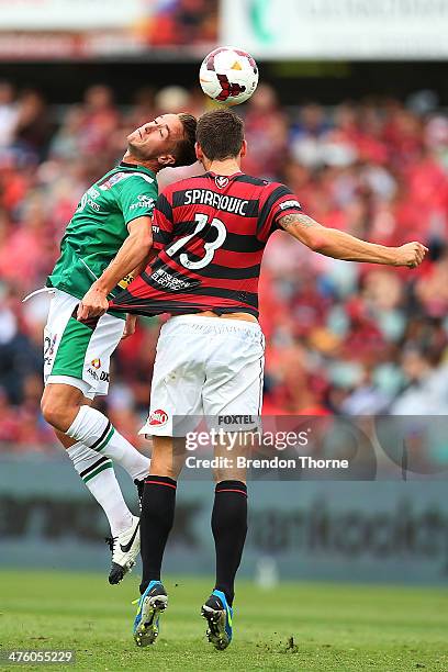 Matthew Spiranovic of the Wanderers competes with Adam Taggart of the Jets during the round 21 A-League match between the Western Sydney Wanderers...