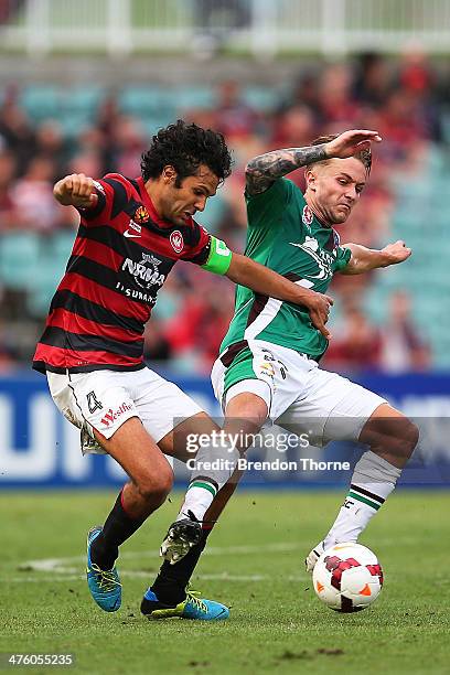 Nikolai Topor-Stanley of the Wanderers competes with Adam Taggart of the Jets during the round 21 A-League match between the Western Sydney Wanderers...