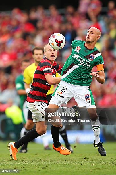 Ruben Zadkovich of the Jets competes with Aaron Mooy of the Wanderers during the round 21 A-League match between the Western Sydney Wanderers and the...