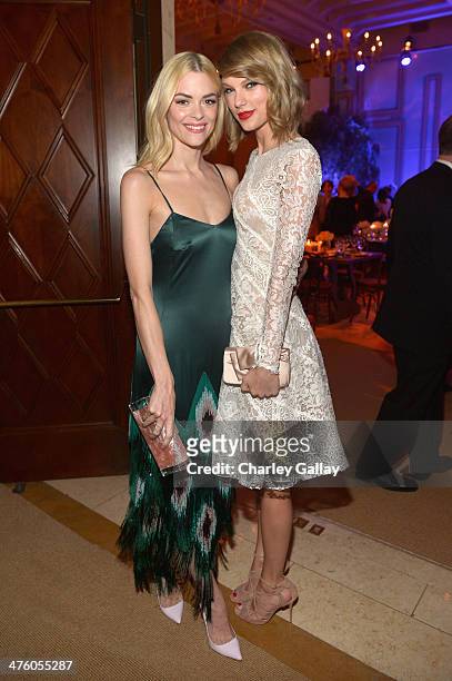 Actress Jaime King and musician Taylor Swift attend The Weinstein Company's Academy Award party hosted by Chopard and DeLeon Tequila at Montage...