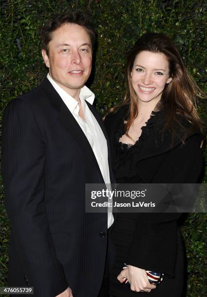 Elon Musk and Talulah Riley attend the Chanel and Charles Finch pre-Oscar dinner at Madeo Restaurant on March 1, 2014 in Los Angeles, California.