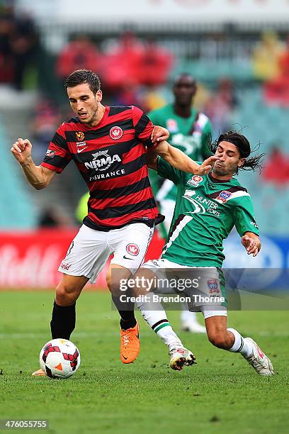 Matthew Spiranovic of the Wanderers competes with Zenon Caravella of the Jets during the round 21 A-League match between the Western Sydney Wanderers...