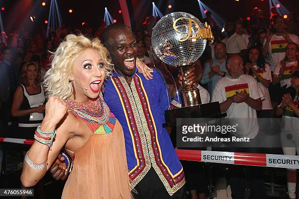 Hans Sarpei and Kathrin Menzinger celebrate after winning the award during the final show of the television competition 'Let's Dance' on June 5, 2015...