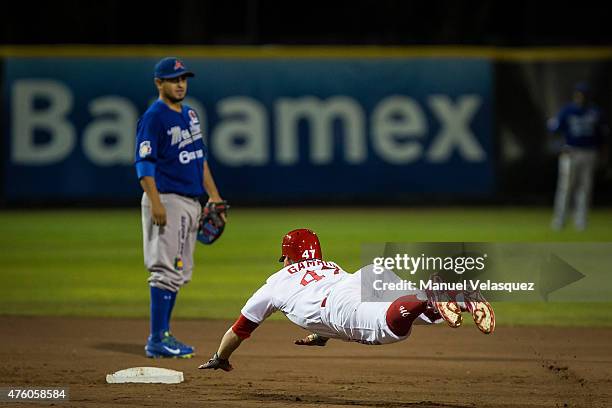 Juan Carlos Gamboa of Diablos Rojos slides on base during a match between Acereros de Monclova and Diablos Rojos as part of Mexican Baseball League...