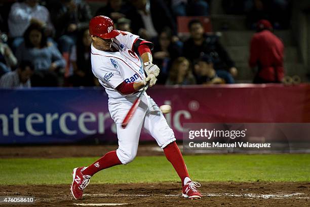 Jesus Lopez of Diablos Rojos hits the ball during a match between Acereros de Monclova and Diablos Rojos as part of Mexican Baseball League 2015 at...