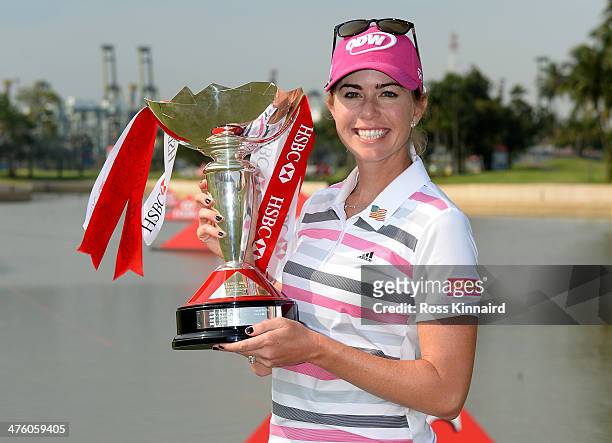 Paula Creamer of the USA poses with the trophy after sealing victory in a play-off during the final round of the HSBC Women's Champions at the...
