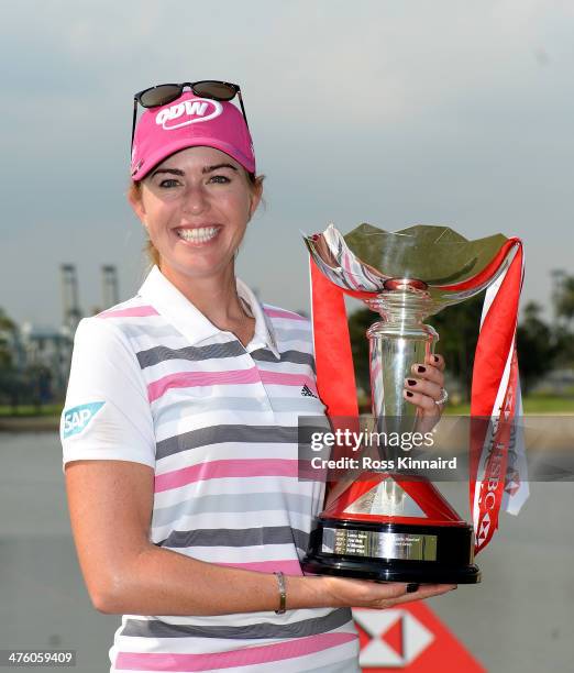 Paula Creamer of the USA poses with the trophy after sealing victory in a play-off during the final round of the HSBC Women's Champions at the...