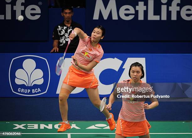 Tang Jinhua and Tian Qing of China play a shot against Ma Jin and Tang Yuanting of China during the 2015 BCA Indonesia Open Semifinals match at...