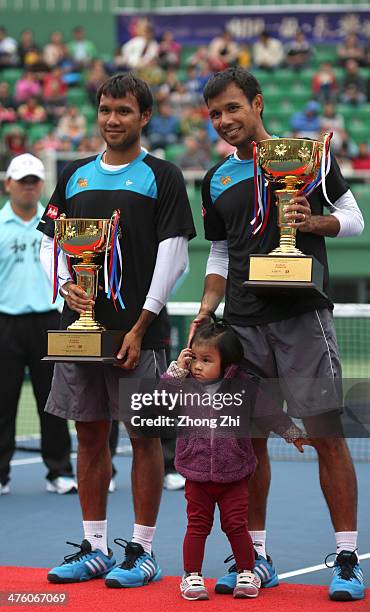 Sonchat Ratiwatana of Thailand with daughter and Sanchat Ratiwatana of Thailand with their trophy after winning their Doubles final match against...