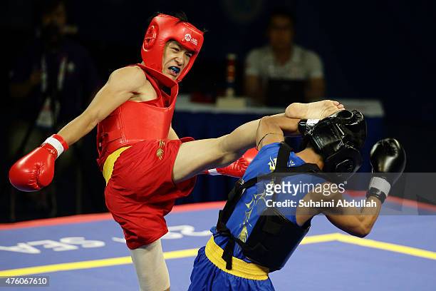 Lee Aik Hong of Singapore fights Ko Chit Ko of Myanmar in the wushu men's sanda 60kg at the Expo Hall 2 during the 2015 SEA Games on June 6, 2015 in...