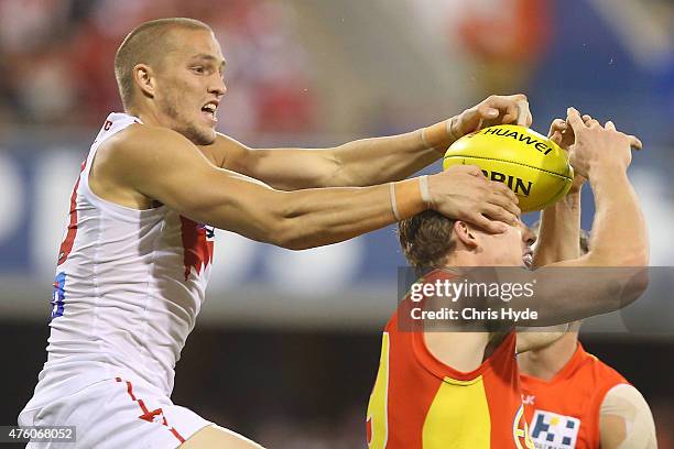 Sam Reid of the Swans and Tom Lynch of the Suns compete for the ball during the round 10 AFL match between the Gold Coast Suns and the Sydney Swans...