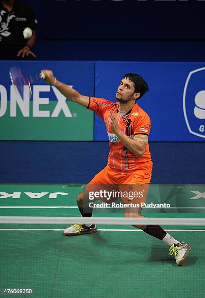 Parupalli Kashyap of India plays a shot against Kento Momota of Japan during the 2015 BCA Indonesia Open Semifinals match at Istora Senayan on June...