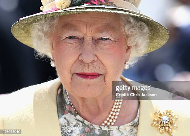 Queen Elizabeth II arrives for the Investec Derby festival at Epsom Racecourse on June 6, 2015 in Epsom, England.
