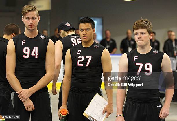 Paul Bittner, Ethan Bear, and David Kase await their turns to perform tests during the NHL Combine at HarborCenter on June 6, 2015 in Buffalo, New...
