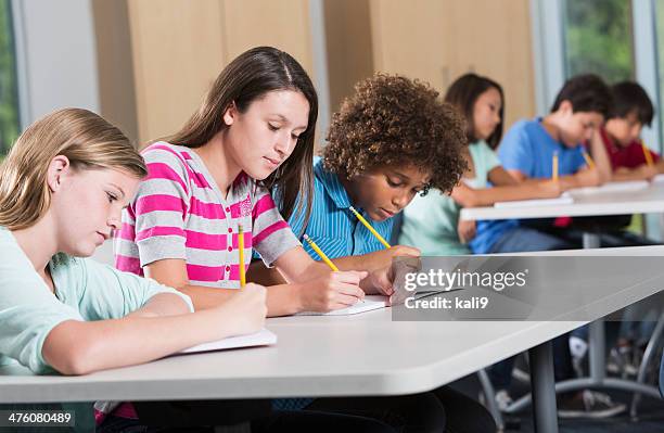 students in classroom - ten to fifteen stock pictures, royalty-free photos & images