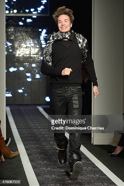 Designer Maxime Simoens acknowledges the audience after the Maxime Simoens show as part of the Paris Fashion Week Womenswear Fall/Winter 2014-2015 on...