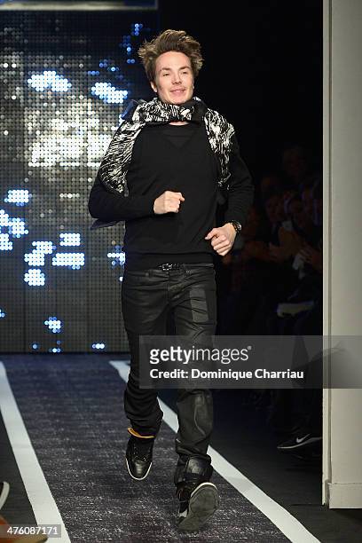 Designer Maxime Simoens acknowledges the audience after the Maxime Simoens show as part of the Paris Fashion Week Womenswear Fall/Winter 2014-2015 on...