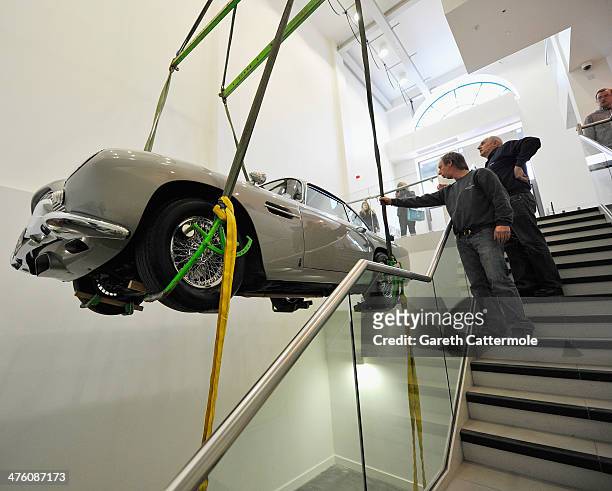 An Aston Martin DB5 used in the film Goldeneye is loaded in to the London Film Museum ahead of the Bond in Motion exhibition, opening 21st March at...