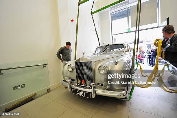 Rolls Royce Silver Cloud ll - Cub 1 used in the film A View To A Kill is loaded in to the London Film Museum ahead of the Bond in Motion exhibition,...