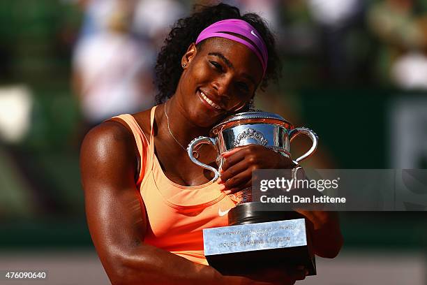 Serena Williams of the United States poses with the Coupe Suzanne Lenglen trophy after winning the Women's Singles Final against Lucie Safarova of...
