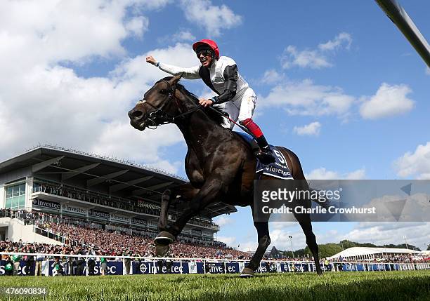 Frankie Dettori celebrates as he rides Golden Horn to win The Investec Derby at Epsom racecourse on June 06, 2015 in Epsom, England.