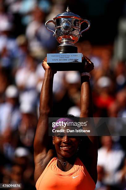 Serena Williams of the United States lifts the Coupe Suzanne Lenglen trophy after winning the Women's Singles Final against Lucie Safarova of Czech...