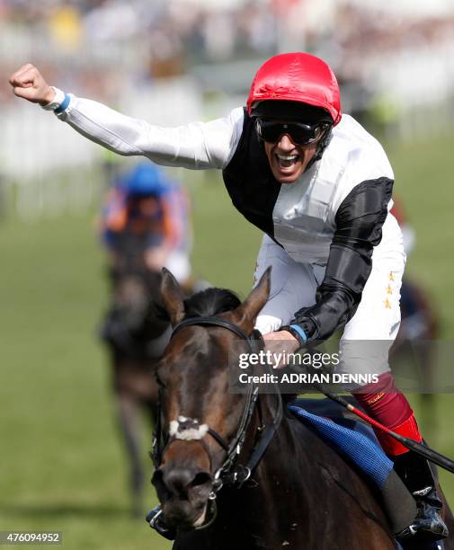 Italian jockey Frankie Dettori riding Golden Horn punches the air as he crosses the finish line to win the Derby horse race on the second day of the...