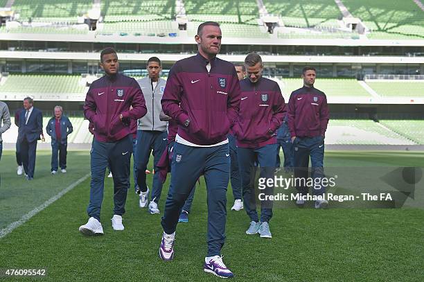 Ryan Bertrand, Chris Smalling, Wayne Rooney, Tom Cleverley and Gary Cahill look on during a team walk around at the Aviva Stadium on June 6, 2015 in...
