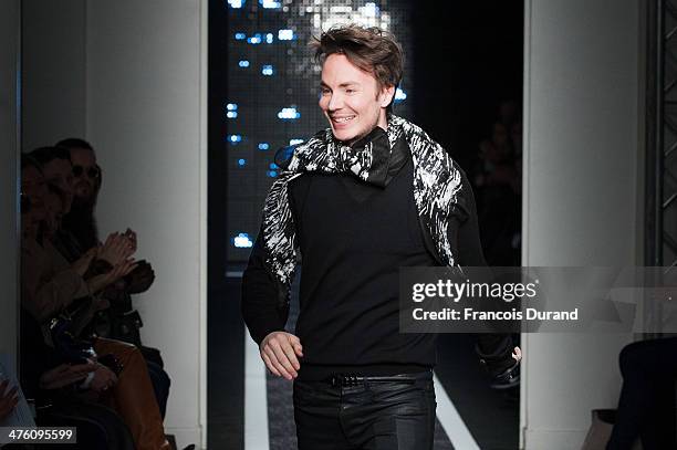 Designer Maxime Simoens walks the runway during the Maxime Simoens show as part of the Paris Fashion Week Womenswear Fall/Winter 2014-2015 on March...