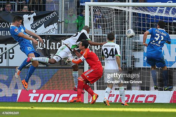 Niklas Suele of Hoffenheim scores his team's second goal against Naldo, goalkeeper Diego Benaglio and Ricardo Rodriguez of Wolfsburg during the...