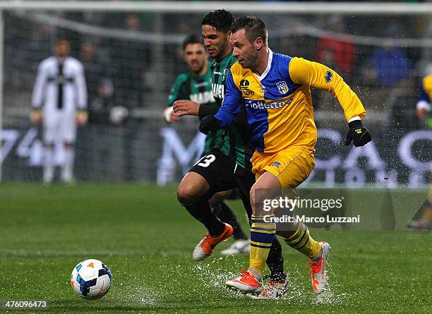 Antonio Cassano of Parma FC competes for the ball with Pedro Mendes of US Sassuolo Calcio during the Serie A match between US Sassuolo Calcio and...