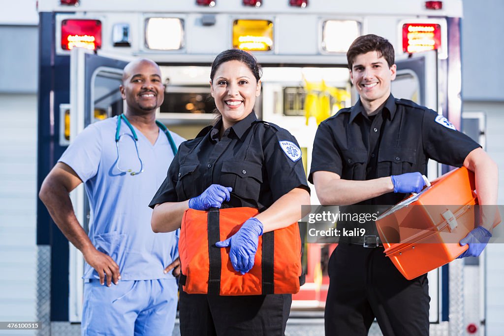 Paramedics and doctor outside ambulance