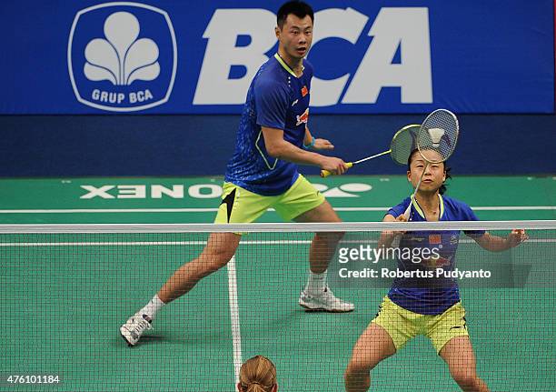 Xu Chen and Ma Jin of China play a shot against Joachim Fischer Nielsen and Christinna Pedersen of Denmark during the 2015 BCA Indonesia Open...