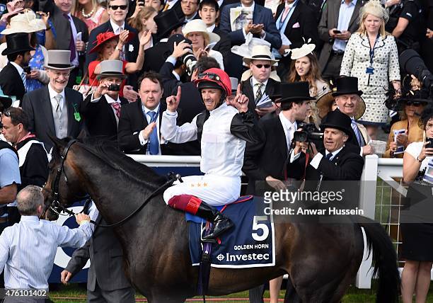 Frankie Dettori celebrates on his horse Golden Horn after winning the Investec Derby at Epsom racecourse on June 06, 2015 in Epsom, England.
