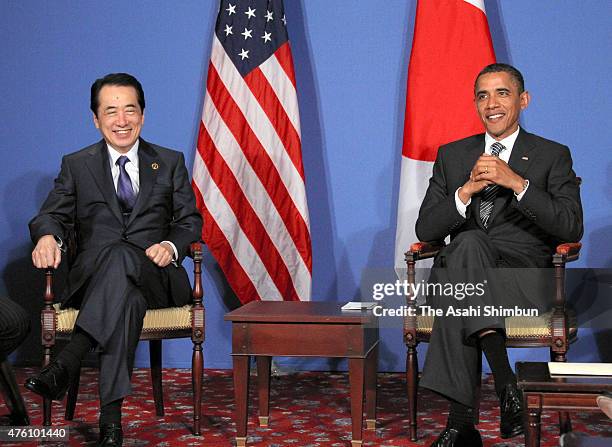 President Barack Obama and Japanese Prime Minister Naoto Kan talk during their bilateral meeting on the sidelines of the G8 summit on May 26, 2011 in...