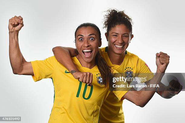Marta and Cristiane of Brazil poses during the FIFA Women's World Cup 2015 portrait session at Sheraton Le Centre on June 6, 2015 in Montreal, Canada.