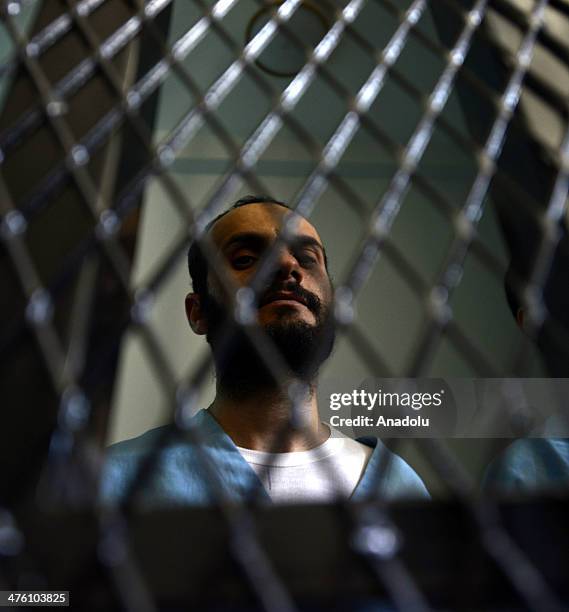 Yemeni suspected al-Qaeda militant, Husain Saleh Abd Rabbu stands behind bars during a hearing as they accused of kidnapping a Swiss woman and...