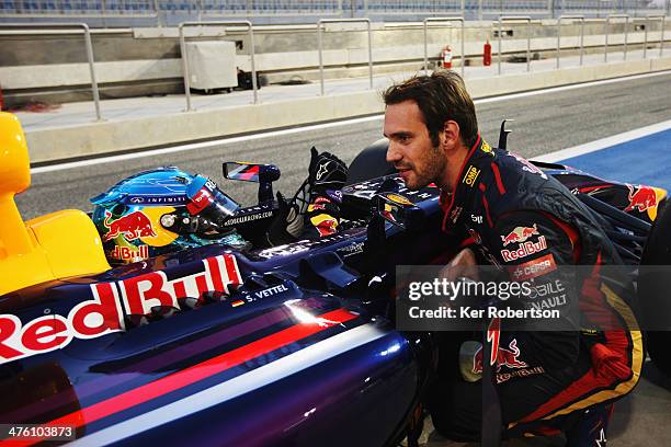 The car driven by Sebastian Vettel of Germany and Infiniti Red Bull Racing suffers a fault and comes to a halt outside the garage of Jean-Eric Vergne...