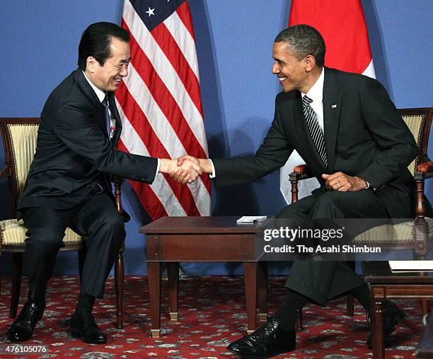 President Barack Obama and Japanese Prime Minister Naoto Kan shake hands during their bilateral meeting on the sidelines of the G8 summit on May 26,...