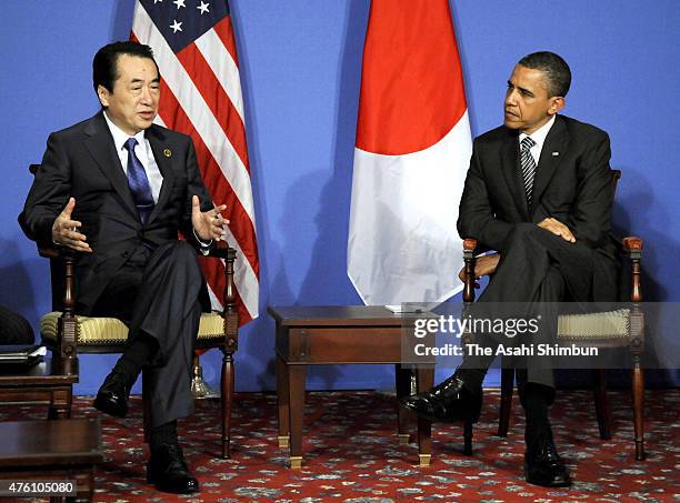 President Barack Obama and Japanese Prime Minister Naoto Kan talk during their bilateral meeting on the sidelines of the G8 summit on May 26, 2011 in...